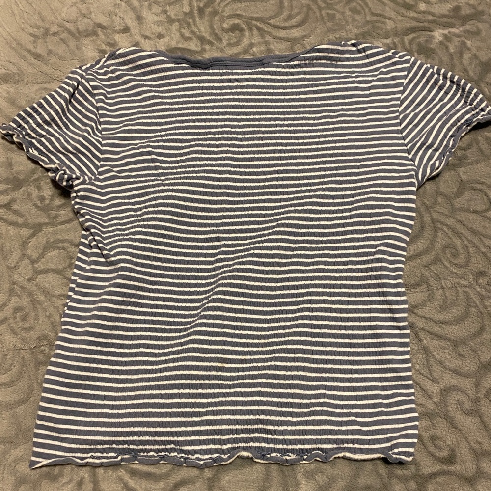 Blue and white striped shirt, stretchy material, size small. No stains or rips